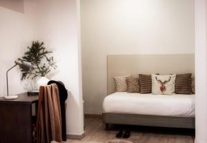 Letto o letti in una camera di Albergo Reale