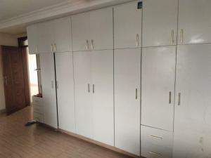 a large white closet with white cabinets in a room at Blessed Home, Nakuru in Nakuru