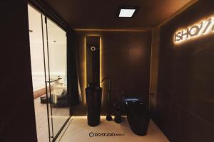 a bathroom with a stall with a toilet and a mirror at Do Studioishome Homestay Dukkha 03 in Ha Long