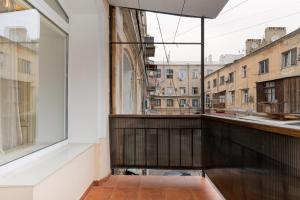 a balcony with a view of a city at Deribasivska 10 Luxury Apartment in Odesa