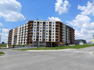 a large building on the side of a street at Alex lux apartman in Kragujevac