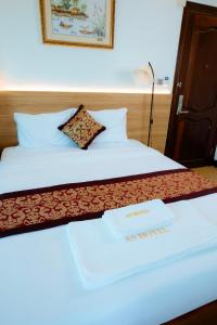 Postel nebo postele na pokoji v ubytování A9 Beach Hotel Da Nang