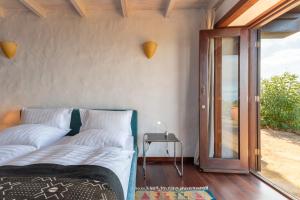 Postel nebo postele na pokoji v ubytování Villa Botánico
