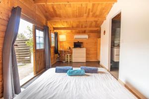 Ένα ή περισσότερα κρεβάτια σε δωμάτιο στο Le Chalet De La Plage +73 φωτογραφίες