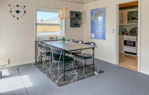 a kitchen with a table and chairs in a room at Gorgeous Home In Spøttrup With Wifi in Spottrup