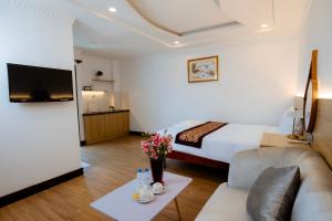 TV a/nebo společenská místnost v ubytování A9 Beach Hotel Da Nang