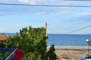 a view of the ocean from a house at Elli Studios & Apartments in Marathokampos