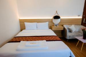 Postel nebo postele na pokoji v ubytování A9 Beach Hotel Da Nang