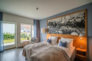Postel nebo postele na pokoji v ubytování Valldal Fjordhotell - by Classic Norway Hotels