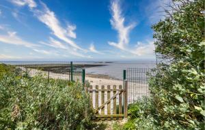 a wooden gate on a beach near the water at Lovely Home In Port-Des-Barques in Le Port-des-Barques +32 photos