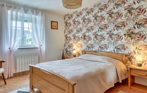 Ένα ή περισσότερα κρεβάτια σε δωμάτιο στο Charmante Maison De Campagne