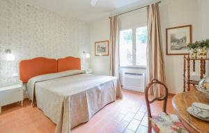 Ένα ή περισσότερα κρεβάτια σε δωμάτιο στο Cozy Home In Sassetta