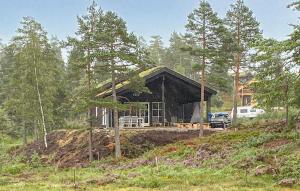 a house being built on top of a hill at 4 Bedroom Nice Home In Åmli in Åmli +4 photos