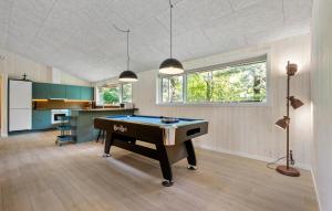 a living room with a pool table in it at 4 Bedroom Gorgeous Home In Oksbøl in Oksbøl