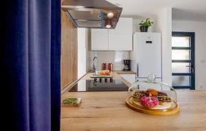 a kitchen with a plate of food on a table at Amazing Home In Barban in Barban +18 photos