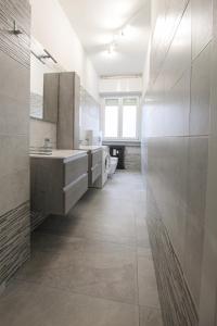 a bathroom with a toilet and a sink at Casa Potos - M1 - San Siro - Rho Fiera in Milan