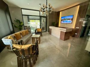 a living room with a couch and a tv at SA Apartments! 150m to the Cleopatra Beach in Alanya +107 photos