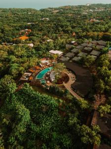 an aerial view of a resort with a swimming pool at Grün Resort Uluwatu in Uluwatu