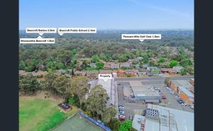 an aerial view of a town with a parking lot at Luxury Room Budget Friendly in Beecroft