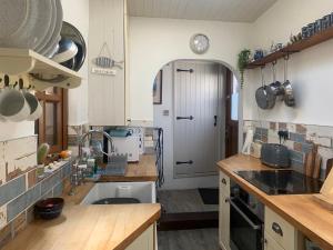 Køkken eller tekøkken på Cockle Bay Cottage