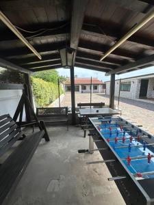 a row of ping pong tables on a patio at Villa Lelli 1 in Rome