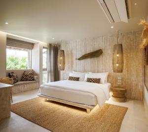 Ein Bett oder Betten in einem Zimmer der Unterkunft Phangan Bayshore Resort Koh Phangan