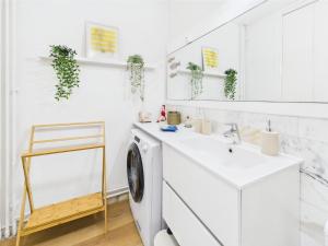 a white laundry room with a sink and a washing machine at -Ocean- Studio renove avec parking et vue mer in Concarneau +15 photos