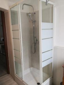 a shower with a glass door in a bathroom at Casa Vista Fiume in Susa +21 photos