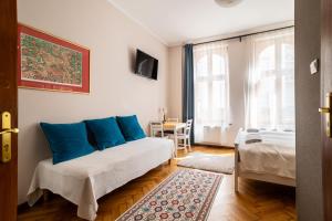 Postel nebo postele na pokoji v ubytování Victus Apartamenty, Apartament Aurora + 18 fotografií
