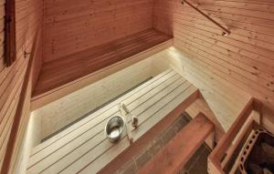 an inside view of a sauna with a sink at Beautiful Home In Berlevåg With Sauna in Berlevåg
