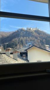 a view of a mountain from a window at Casa degli Angeli in Varallo