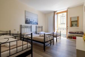 Ένα ή περισσότερα κρεβάτια σε δωμάτιο στο Apartment Katia - Menaggio