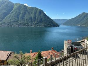 a view of a large body of water with mountains at Colonno Panoramica Lago Di Como in Colonno