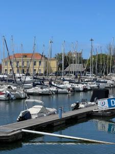 a marina filled with lots of boats in the water at DeepBlue sail boat in Lisbon