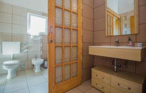 a bathroom with a toilet and a sink at Apartman Tara - Makarska by Villas Guide in Makar