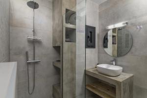 a bathroom with a sink and a shower at Aspras Luxury Apartments in Koutsounari