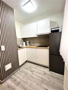 Køkken eller tekøkken på City Ferienwohnung direkt an der U-Bahn