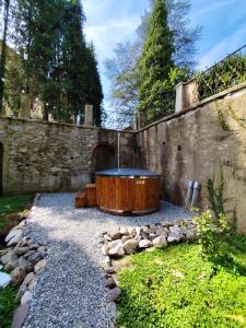 a hot tub in the middle of a garden at Casa Valduggia in Valduggia
