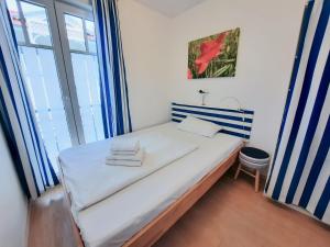 Ein Bett oder Betten in einem Zimmer der Unterkunft Villa Rosa - Apt. 15