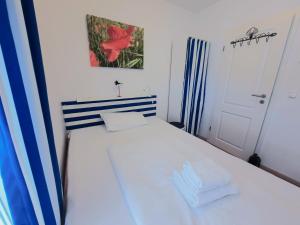 Ein Bett oder Betten in einem Zimmer der Unterkunft Villa Rosa - Apt. 15