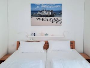 Ein Bett oder Betten in einem Zimmer der Unterkunft Villa Rosa - Apt. 15