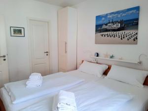 Ein Bett oder Betten in einem Zimmer der Unterkunft Villa Rosa - Apt. 15