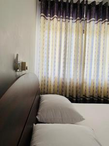 Postel nebo postele na pokoji v ubytování Hotel Ameliya