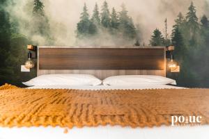 Postel nebo postele na pokoji v ubytování Maison del Bosco - Poluc Apartments bilocale