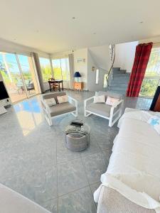 En eller flere senger på et rom på Atlantide - Somptueuse Villa Classée 4 étoiles - Saint-Clair - Vue Exceptionnelle - Piscine