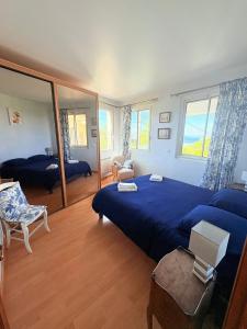En eller flere senger på et rom på Atlantide - Somptueuse Villa Classée 4 étoiles - Saint-Clair - Vue Exceptionnelle - Piscine
