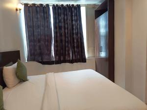 Postel nebo postele na pokoji v ubytování Hotel KRON