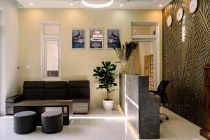 a living room with a couch and a table at Homestay Tự Do in Hue
