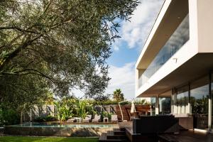 a view of the house from the backyard at Villa BAHIA Sète - Luxury Villa - Beachfront in Sète
