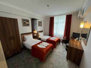Postel nebo postele na pokoji v ubytování Hotel Topkapı + 37 fotografií